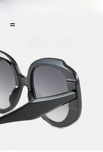 Detail showing high-elasticity lightweight frame and smooth texture of black sunglasses
