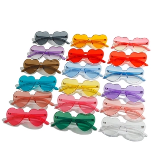 Set of 16 colorful heart-shaped rimless sunglasses in various trendy candy colors