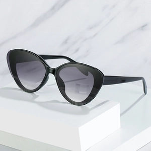Fashionable black cat eye sunglasses with gray gradient lenses for women style