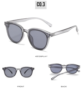 Three-view display of transparent grey cat-eye sunglasses with metal rivet details
