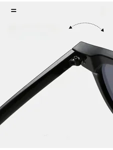 Macro shot of durable metal hinges on black cat-eye sunglasses with grey lenses