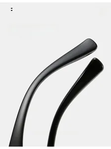 Detail shot of ergonomic curved black sunglass legs with smooth matte finish texture
