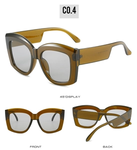Detail view of large square frame sunglasses in tea color with light gray lenses