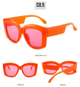 Detail view of oversized orange square sunglasses with gradient pink lenses from multiple angles