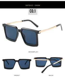 Detail view of square black sunglasses with gold metal hinges and dark blue lenses