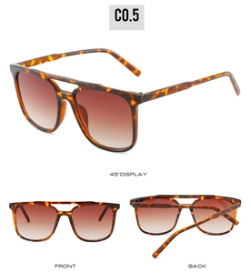 Detail view of tortoiseshell double bridge sunglasses with brown gradient lenses