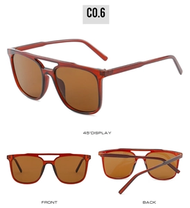 Detail view of dark red translucent pilot sunglasses with double-bridge frame and brown lenses