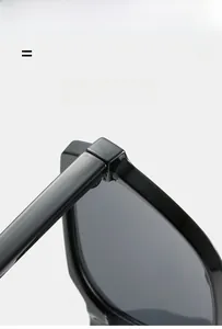 Detail of high-quality hinge and elastic texture material on black oversized sunglasses