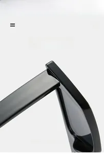 Detail view of smooth hinge and high-quality elastic texture on black rectangle sunglasses