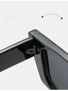Macro detail of high-quality metal hinges on black rectangular chunky sunglasses