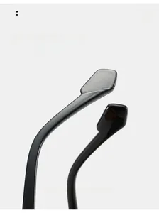Detail of curved ergonomic temple legs on black glossy sunglasses for comfortable wear