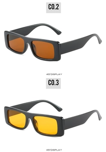 Detail view of retro rectangle sunglasses in glossy black frames with amber and yellow lenses