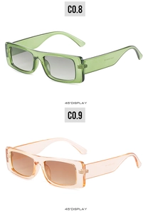 Detailed 45-degree view of retro rectangular sunglasses in green and pink frames