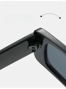 Close-up of durable metal reinforced hinges on vintage square black sunglasses frame