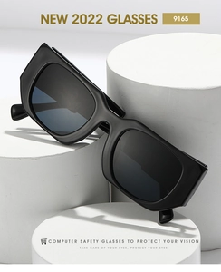 Macro view of model 9165 vintage square glasses with black frames on white pedestals