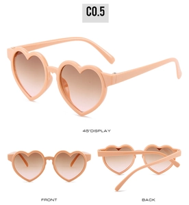 Multiple views of heart-shaped kids sunglasses with pink frames and gradient lenses