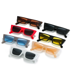 Set of seven chunky rectangular sunglasses in various colors on white background
