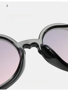 Macro detail of the integrated comfortable nose pads on purple gradient heart sunglasses