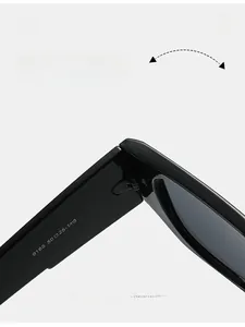 Macro shot of durable metal hinges and size parameters on black square sunglasses