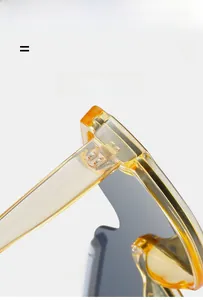 Détail de la monture de lunettes de soleil jaune transparent montrant la charnière
