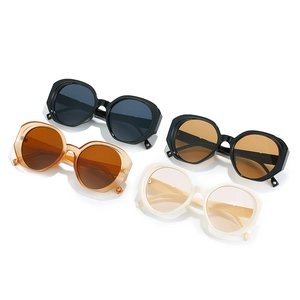 Stylish oversized geometric sunglasses set in black, orange, and cream frames