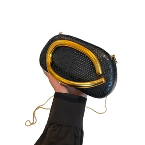 Snake pattern evening clutch bag with large gold metal handle and chain strap