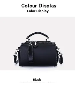 Détail du sac Boston noir avec surpiqûres contrastées blanches et finitions argent