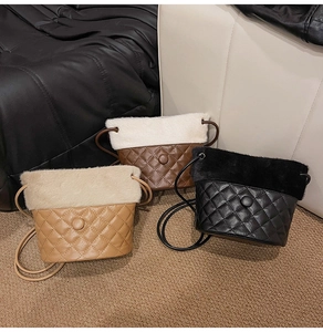 Close-up of diamond quilted faux leather bucket bags with faux fur trim in three colors