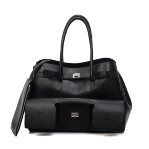 Large black leather tote bag with functional pockets and silver hardware on white background