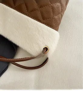 Close-up of diamond-quilted leather and plush faux fur texture with metal eyelets