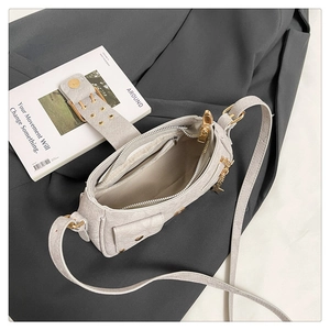 Detail showing the gray textured interior, inner zipper pocket, and gold star charm