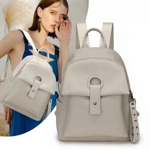 Detail of lychee pattern leather backpack featuring a stylish metal ring buckle closure