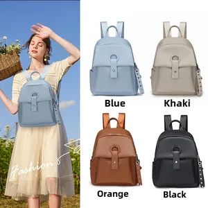 Litchi pattern leather backpack for women featuring stylish metal buckle and rivet straps