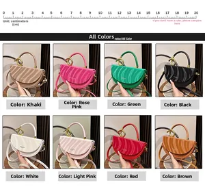 Detail view of semi-circular saddle bags in 8 colors with chic gold ring handles