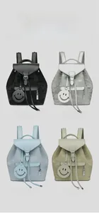 Detailed comparison of vintage style backpacks in black, white, blue, and khaki colors