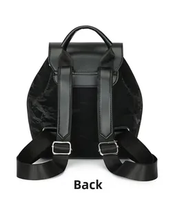 Back view of minimalist black nylon backpack with adjustable straps and leather flap