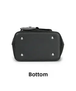 Detail view of the black leather backpack bottom with silver metal protective studs