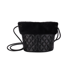 Retro black quilted leather bucket bag with plush faux fur trim and crossbody strap