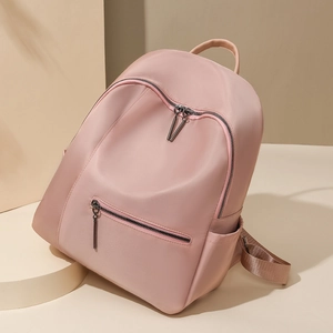 Minimalistische lichtroze nylon rugzak voor dames met meerdere vakken en handvat