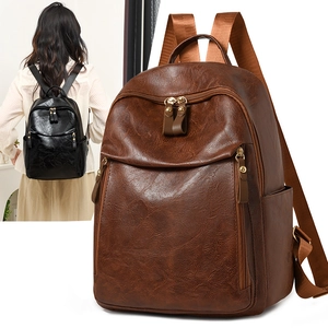 Macro detail of vintage brown leather backpack texture and side zipper storage compartment