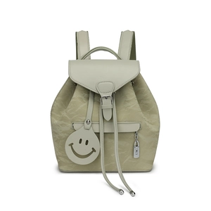 Minimalist creamy beige backpack with pleated texture and cute smiley face pendant