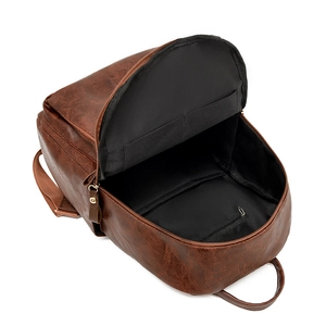 Retro brown pebble grain leather backpack with interior compartments and spacious storage