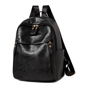 Retro black leather backpack for women with gold zippers and minimalist outdoor style