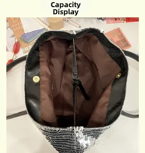 Silver sequin tote bag interior featuring brown lining, magnetic buckle and roomy capacity