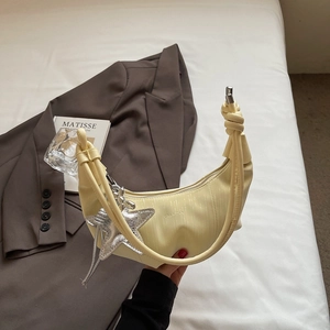 Chic pleated half-moon shoulder bag in cream yellow with stylish silver star charm