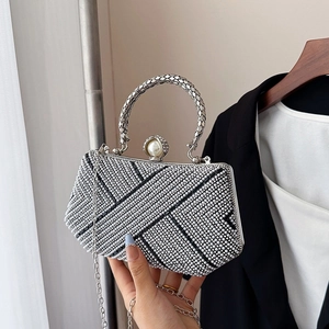 Elegant silver evening clutch bag with sparkling rhinestones, pearl clasp and metal handle