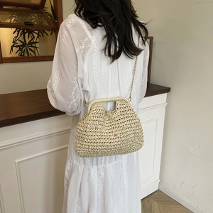 Fashionable beige hand-woven straw bag with U-shaped metal closure and slim gold chain strap