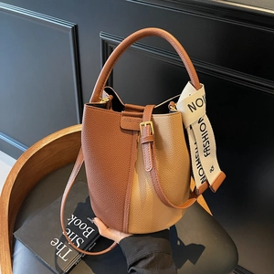 Litchi pattern leather bucket bag in brown and beige with stylish decorative scarf