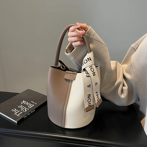 Chic color-block bucket bag in brown lychee texture leather with decorative silk scarf