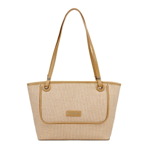 Minimalist straw tote bag with beige weave and brown leather trim on white background